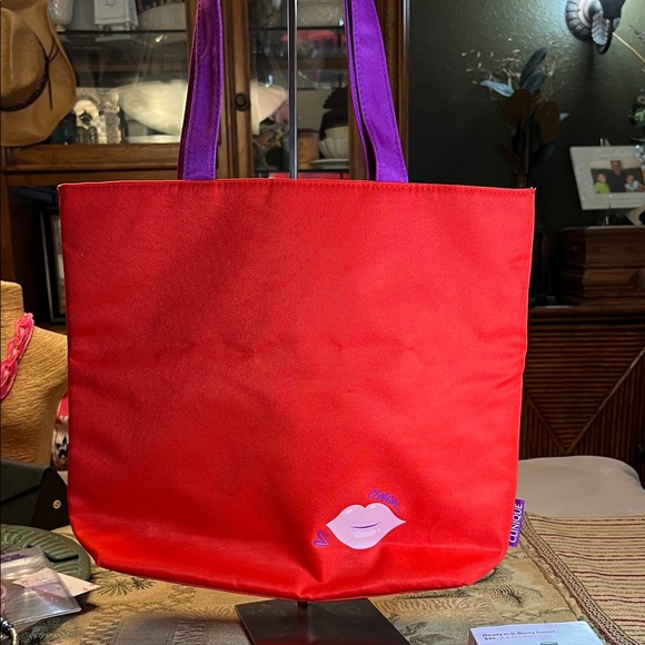 Clinique Handbags - Clinique Scarlet Tote with Violet Handles
